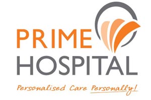 Table with chairs and flowers located near lounge area and kitchen in spacious room of contemporary apartment